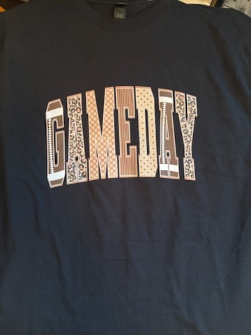 A navy handmade t-shirt with GAMEDAY printed across the chest in patterned varsity letters